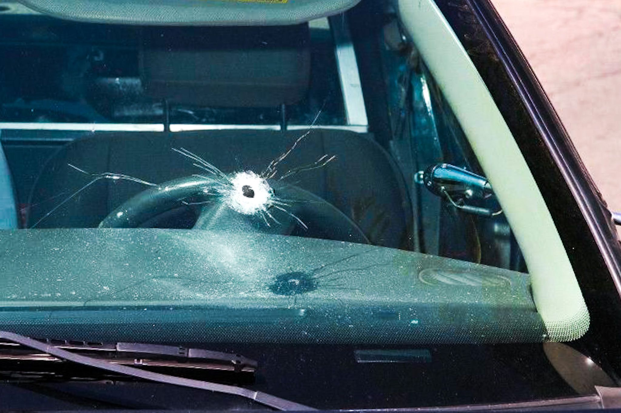 single bullet hole through a windshield