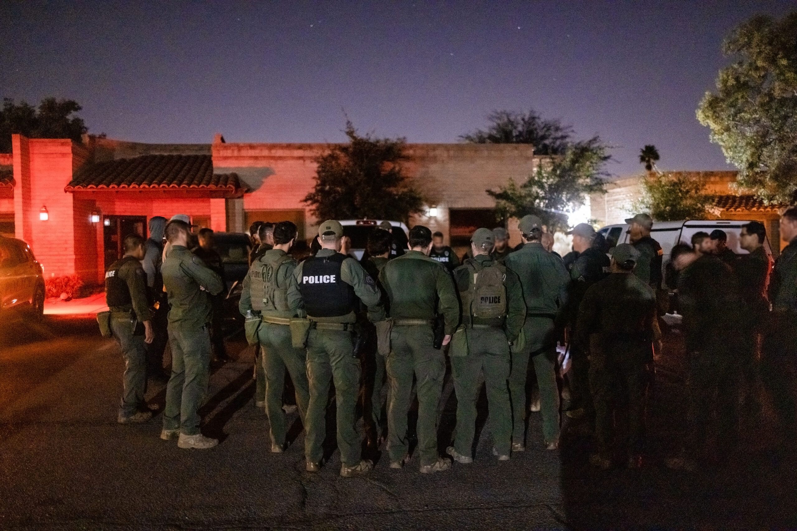 A group of Special Tactics Officers gather for a briefing before a training mission