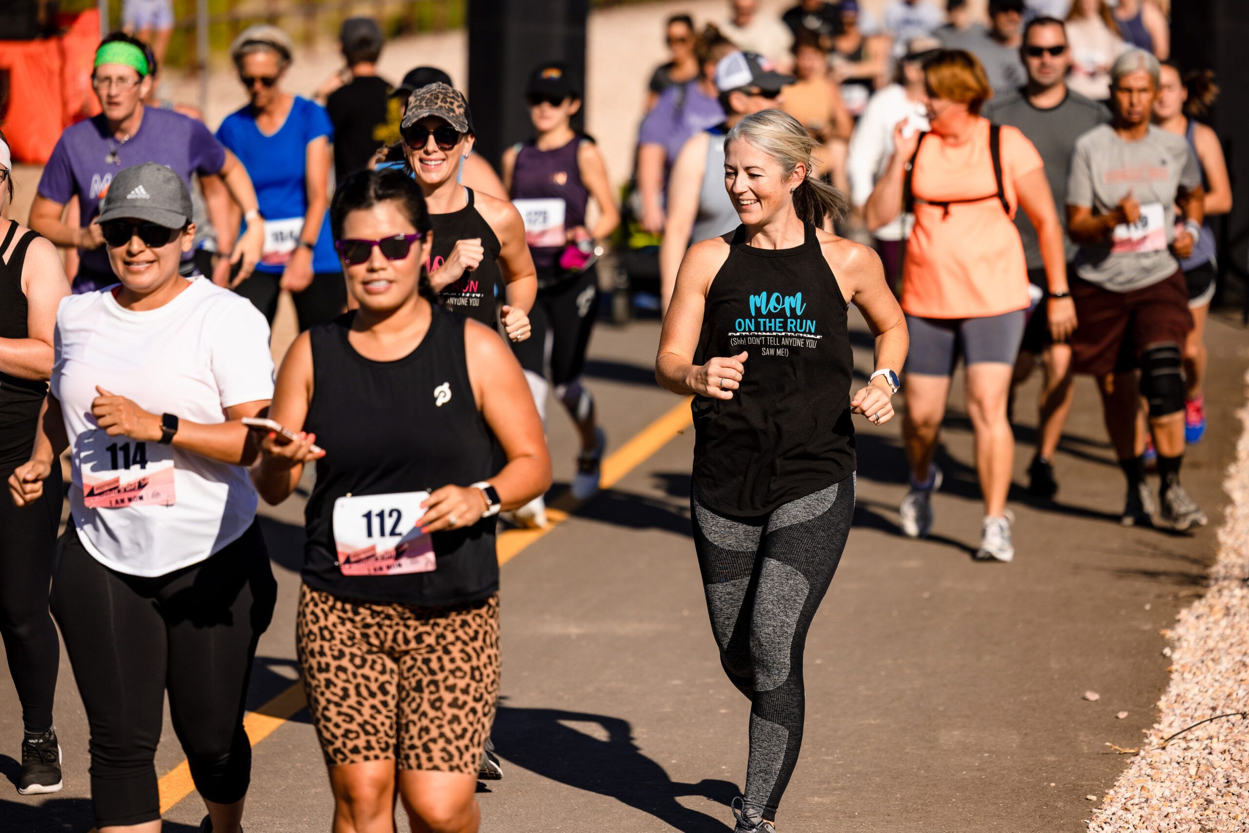 Runners competing in a race in the sun.