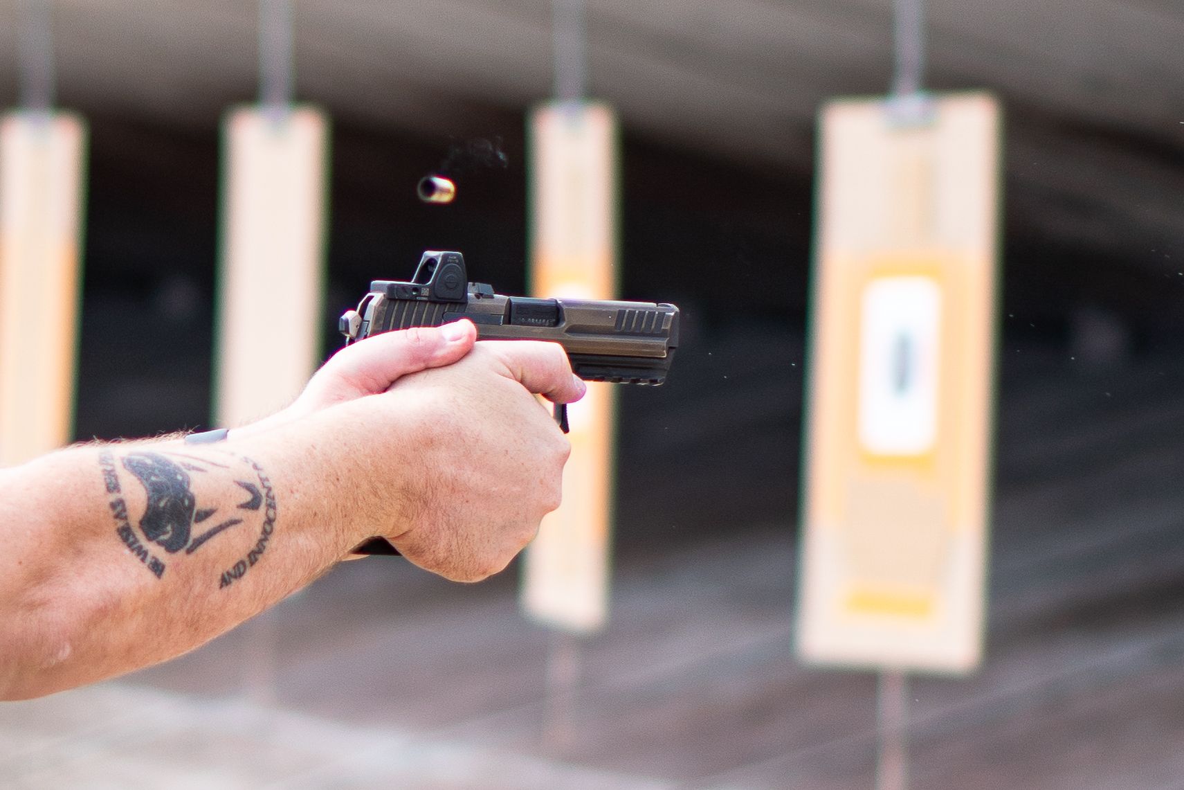 a pistol with a "red dot" optic attached to it