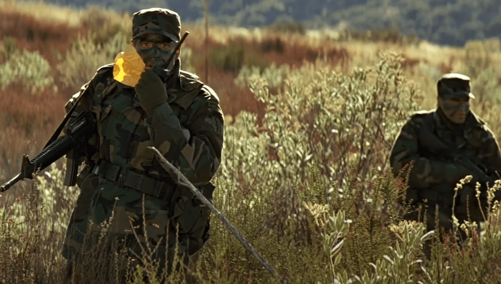 Screenshot 2025-07-14 051258 a clip from the movie Clear and Present Danger, the search team locates where the sniper ate his lunch. They hold up a wrapper from a fast food resturant.